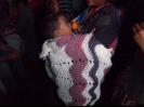 A mother and child with a prayer shawl.