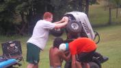 Brad helping Steve with his lawn mower.