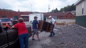 Helping a family get some things from the warehouse.