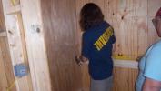 Beth and Ashley putting up shelving