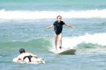 Ella surfing