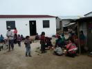 Women and children eating outside