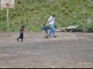 Josh playing soccer with school children