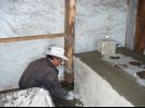 Owner of second stove helping with Stucco