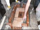 Adding fire brick to the top of the sand level