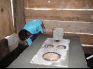 Owner working on stucco for his stove