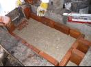 Laying the first of the fire bricks