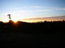 Sun peeking over the hill at Xolja