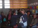 A family giving a gift to Kim W.