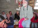 Bill receiving a gift from a family
