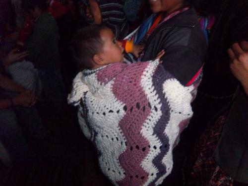 A mother and child with a prayer shawl.