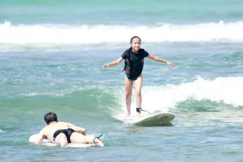 Ella surfing