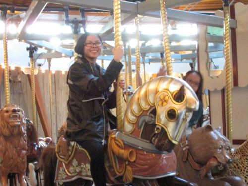 Grace taking a ride at the gardens