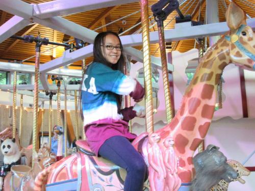 Ella taking a ride at the Gardens