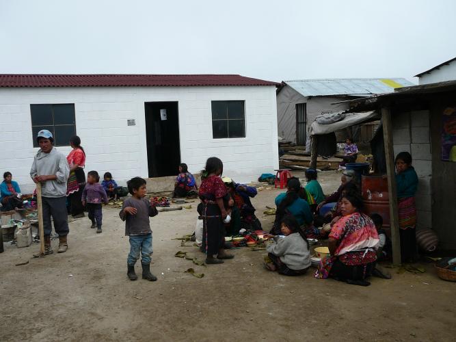 Women and children eating outside