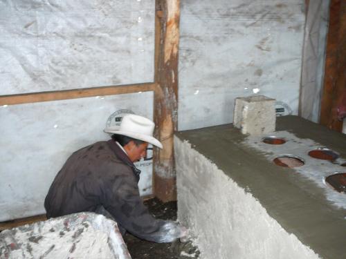 Owner of second stove helping with Stucco