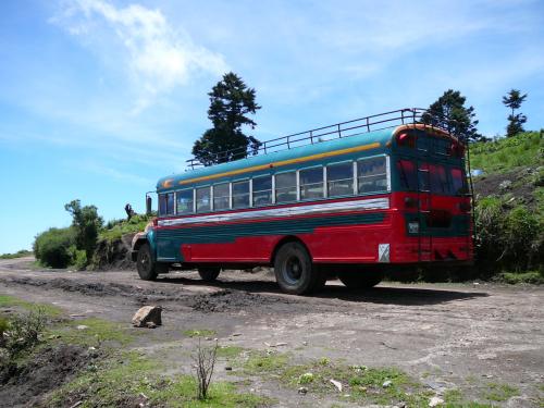 Chicken Bus going to pick up workers for the day