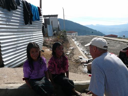 Wayne teaching 2 girls to sing 