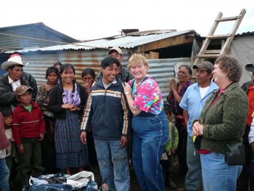 The teacher being presented with school supplies