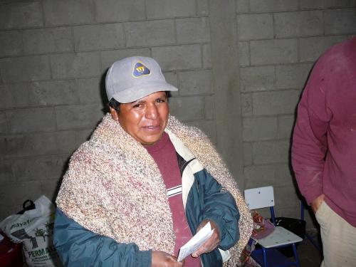 Don Policario (the mason) receiving a prayer shawl