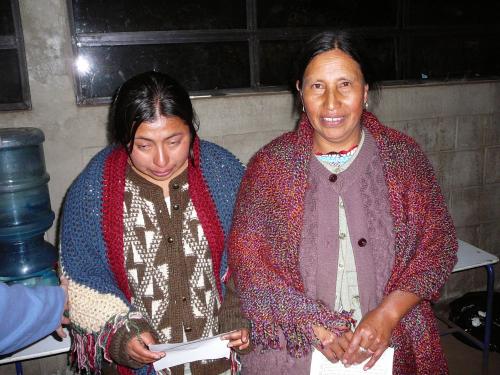 Chirstina and Juana receiving  prayer shawls (Our cooks)
