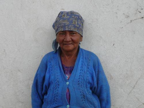 Grandmother waiting for the stove to be finished