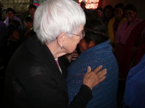 Florence giving a Prayer Shawl to a stove recipient