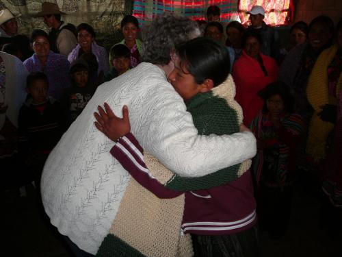 Gynanne giving a Prayer Shawl to a stove recipient