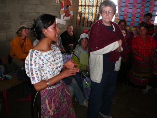 Gloria translating for the Prayer Shawl presentation
