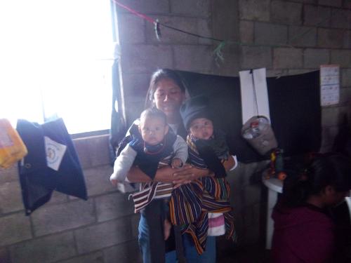 Lupe babysitting so the women could knit.