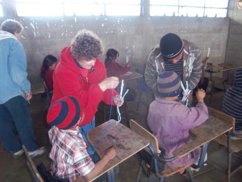 Getting the children started on the head bands.