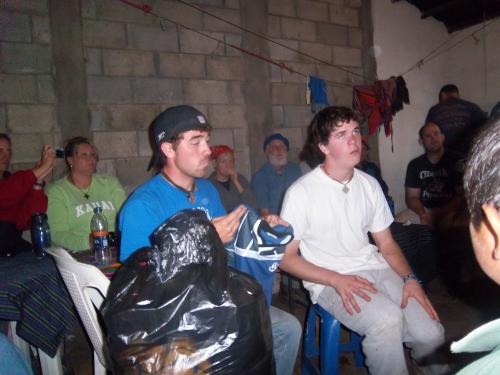 Tyler and Dan giving the soccer equipment to the village.